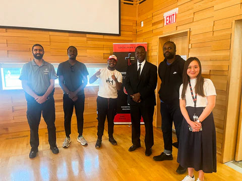 Blackbird Security guards stand with Dreaming in Colour program participants and leaders