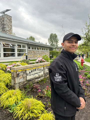 Blackbird security guard in uniform outside Klahanie Canoe Club