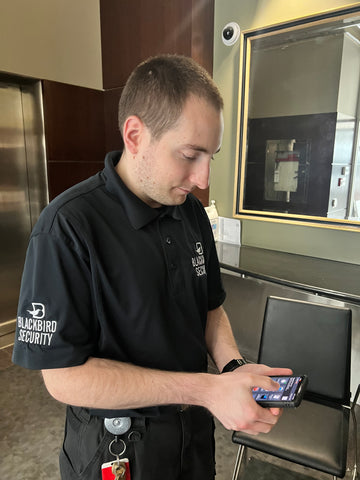 Blackbird security guard doing report on security app