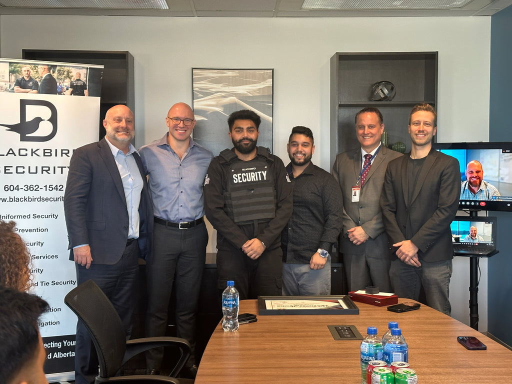 Blackbird Security tactical Security Guard, Gulab Singh, is presented with an award at the Blackbird head office.