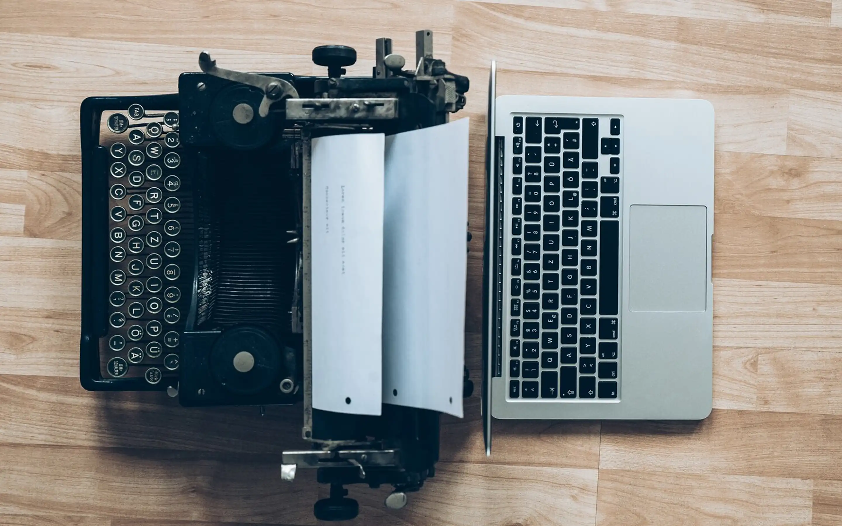 Photo of typewriter and laptop side by side