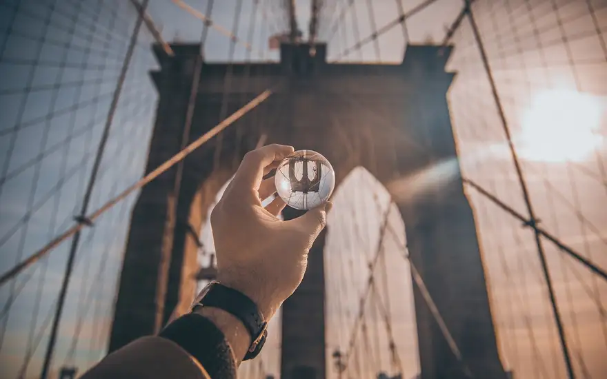 A picture of a hand with a glass bowl