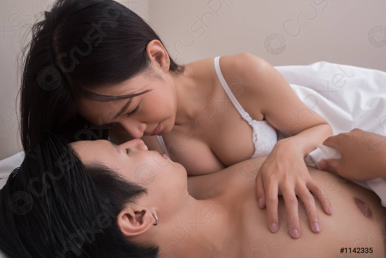 young-couple-foreplay-bed-1142335.jpg