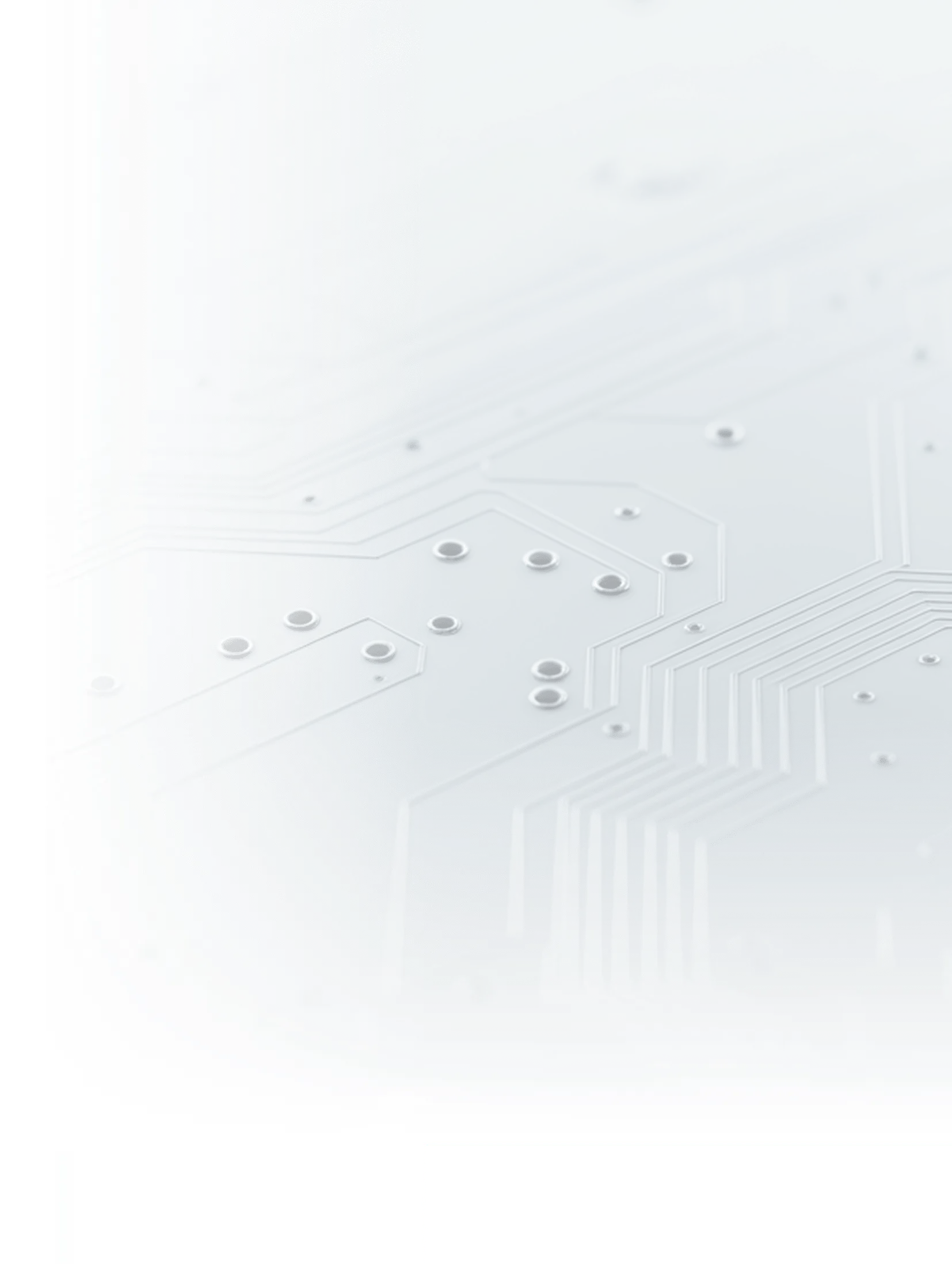 Close-up of a gray circuit board with metallic solder points and etched pathways.