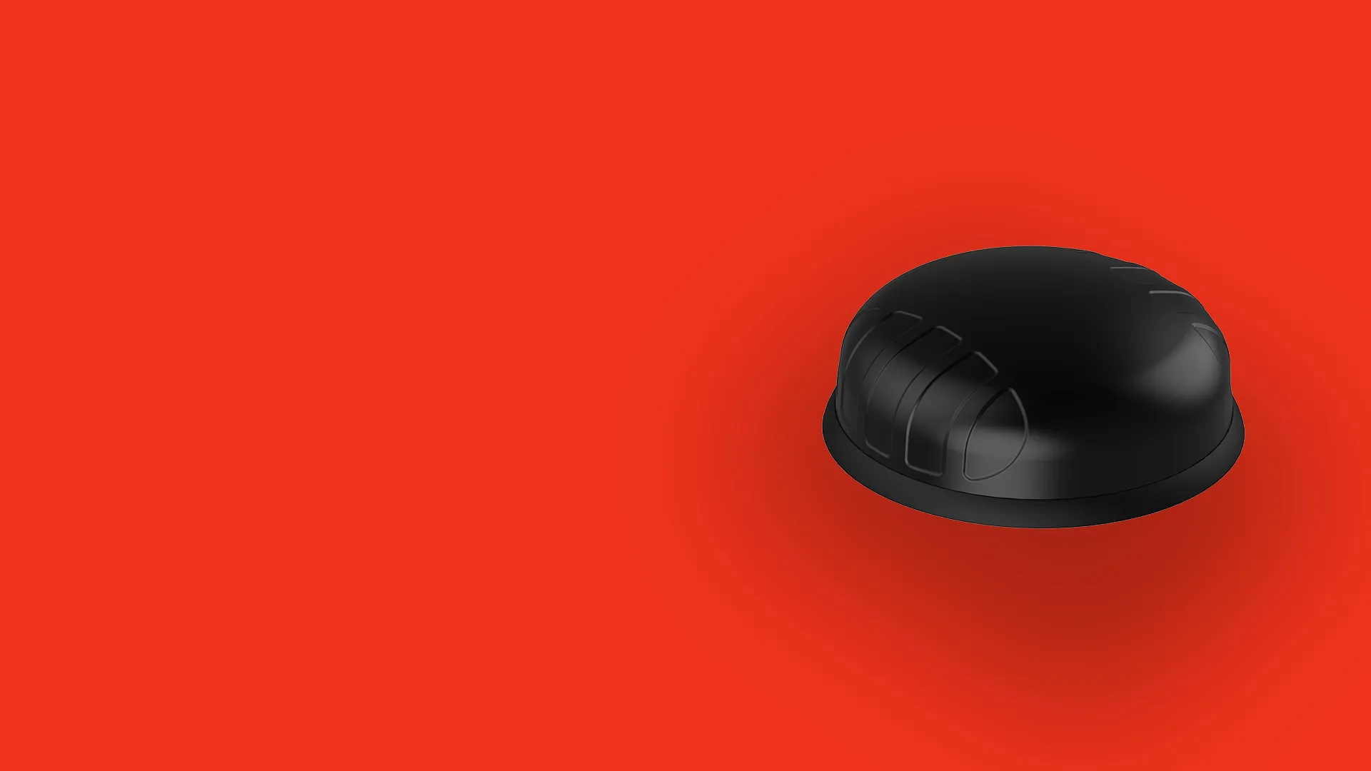 Black dome-shaped device with subtle geometric patterns on a solid red background.