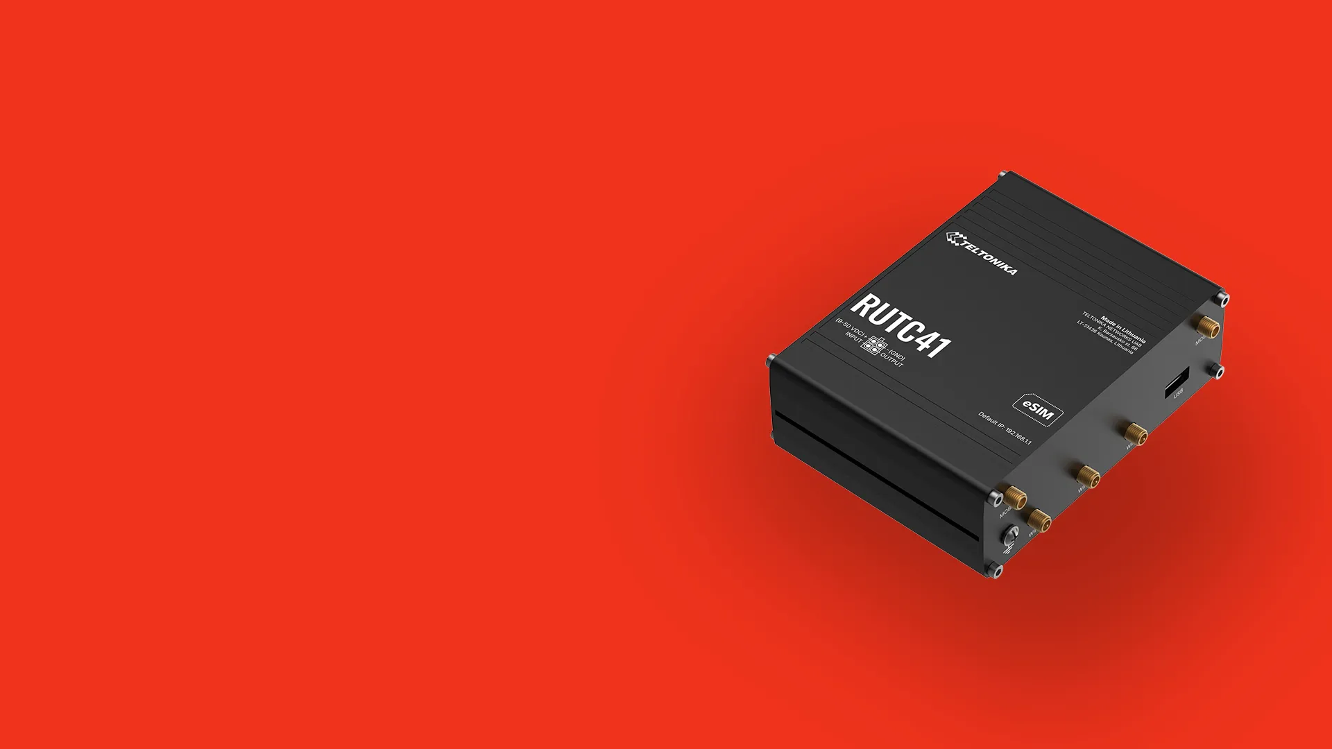 Black Teltonika RUTC41 industrial cellular router with multiple antenna connectors on a red background.