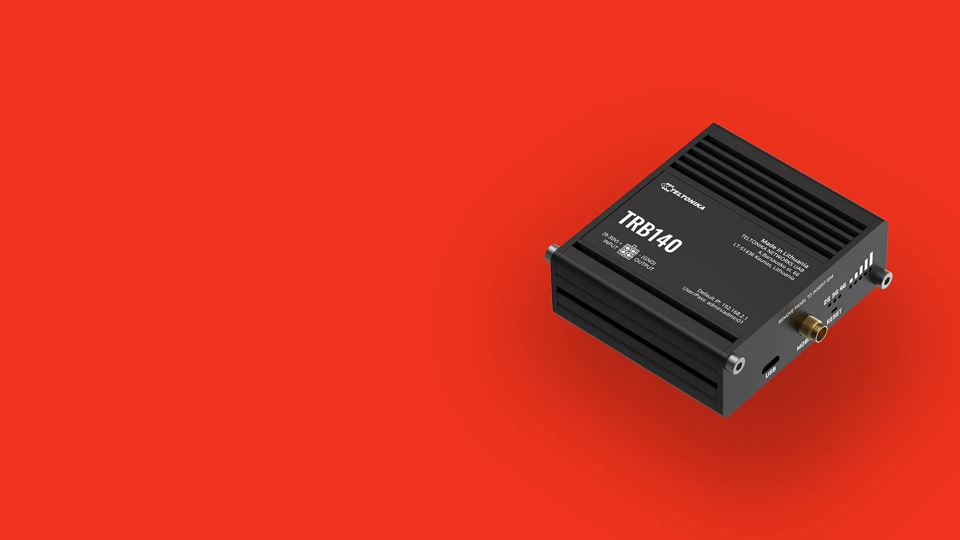 Black Teltonika TRB140 industrial cellular router on red background.