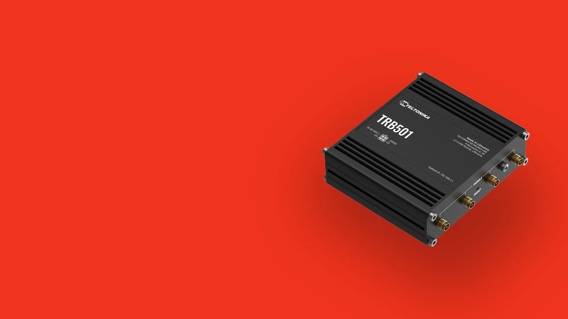Black Teltonika TRB501 industrial router device on bright red background.