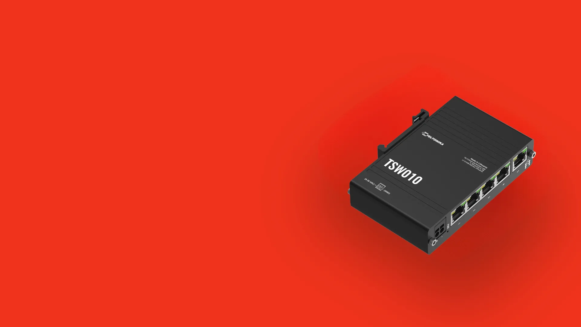 Black Teltonika TSW010 network switch with five Ethernet ports on a red background.