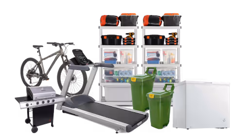 Various garage items including shelving, treadmill, bike, chest freezer, and BBQ