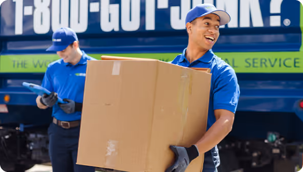 1-800-GOT-JUNK? junk removal team picking up junk