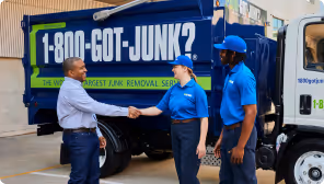 Retail customer shaking hands with 1-800-GOT-JUNK? team member