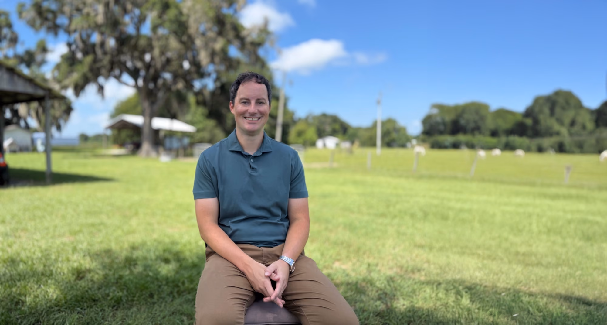 Nick Fox seated outdoors on his Florida farm