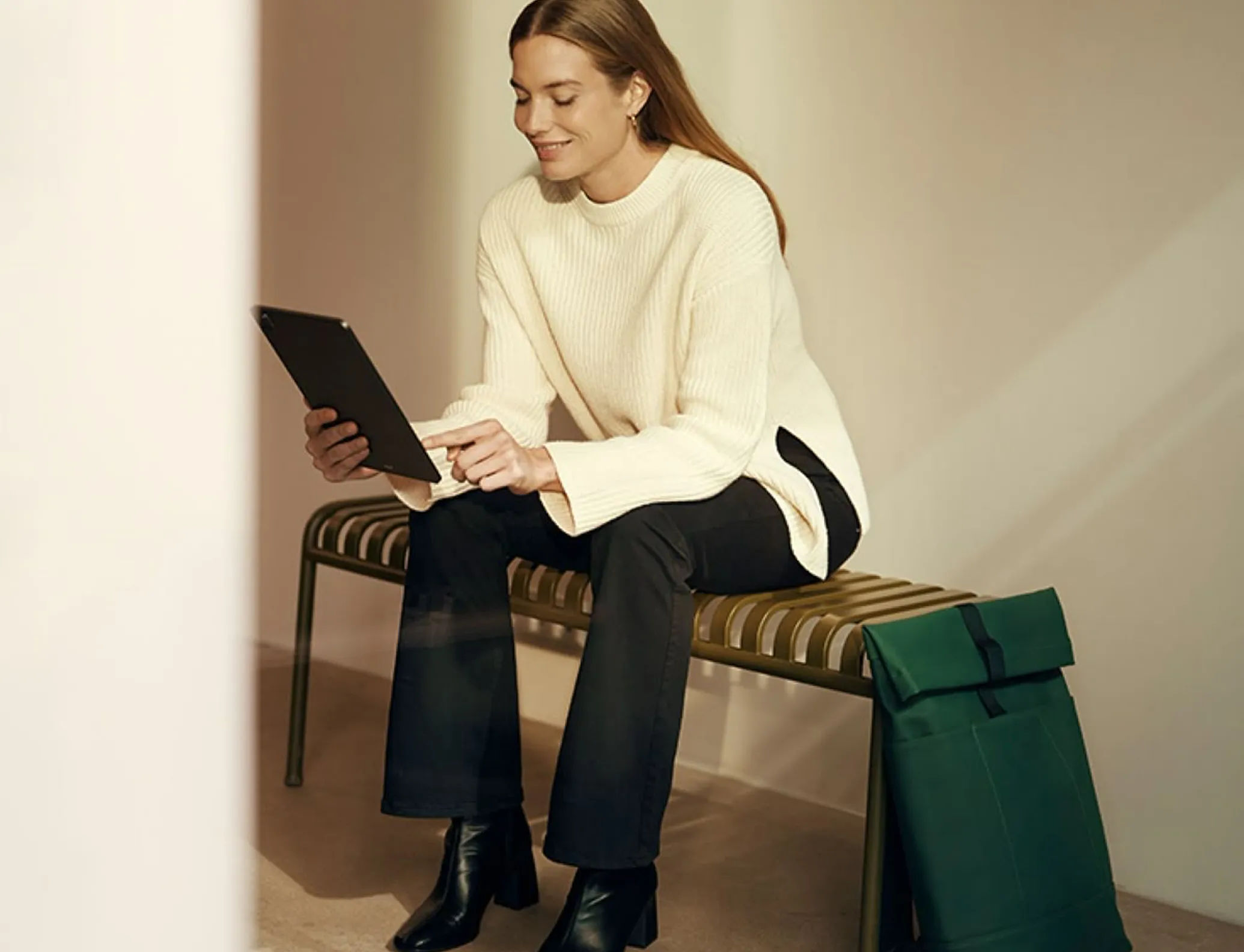 A woman working on a tablet