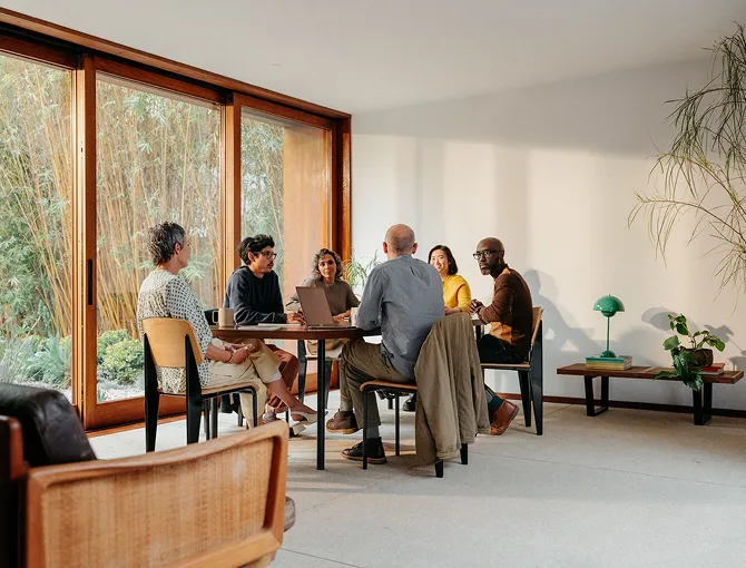 A group of people sitting at the table