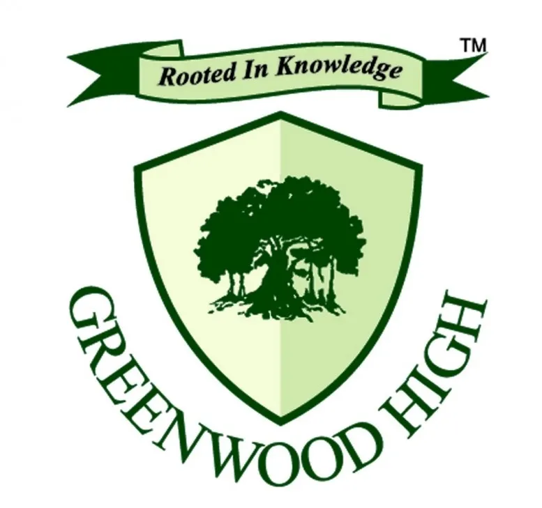 Greenwood High logo featuring a shield with a large tree in the center and a banner above reading 'Rooted In Knowledge'.