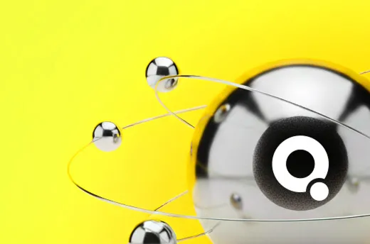 Metallic spheres orbiting a larger central sphere with a black and white circular logo on a bright yellow background.