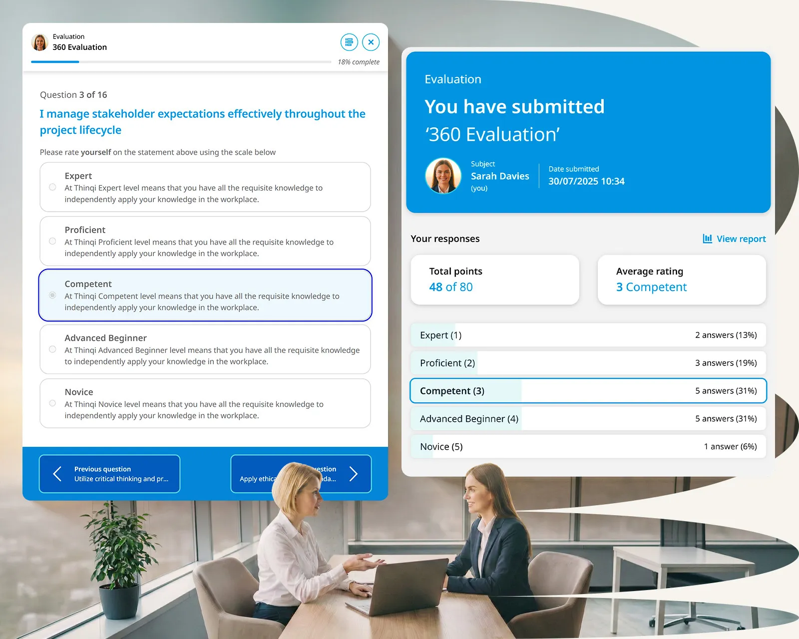 A woman sitting at a desk with a laptop and a potted plant in front of her.