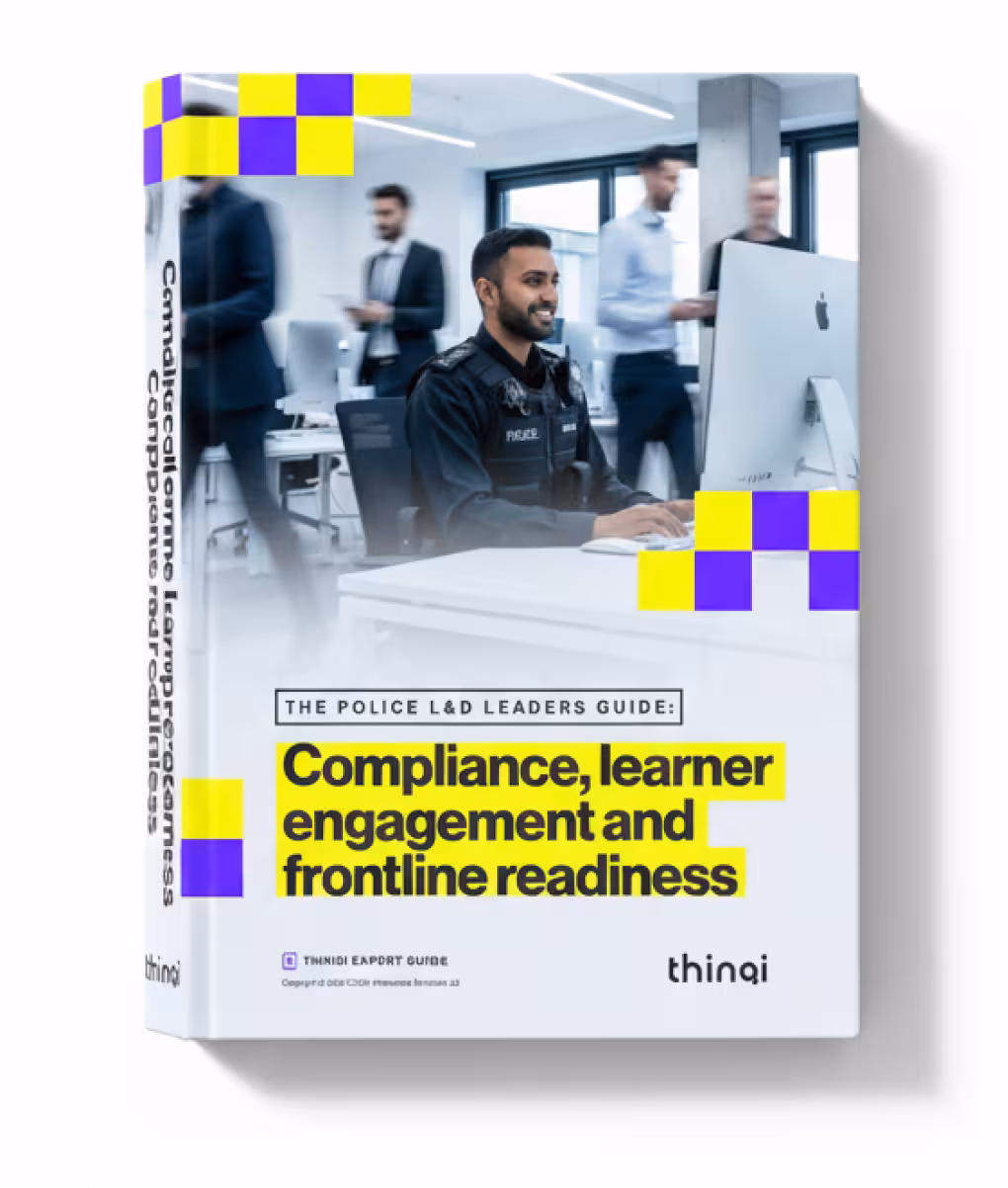 Book cover titled 'The Police L&D Leaders Guide: Compliance, learner engagement and frontline readiness' featuring a smiling police officer working at a computer in an office with blurred colleagues in the background.