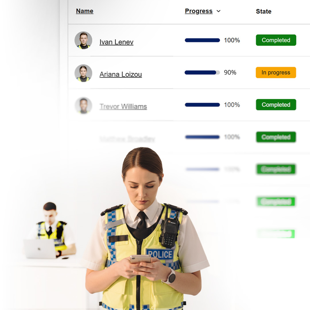 Female police officer in a yellow reflective vest looking at her phone with a blurred progress and status table in the background.