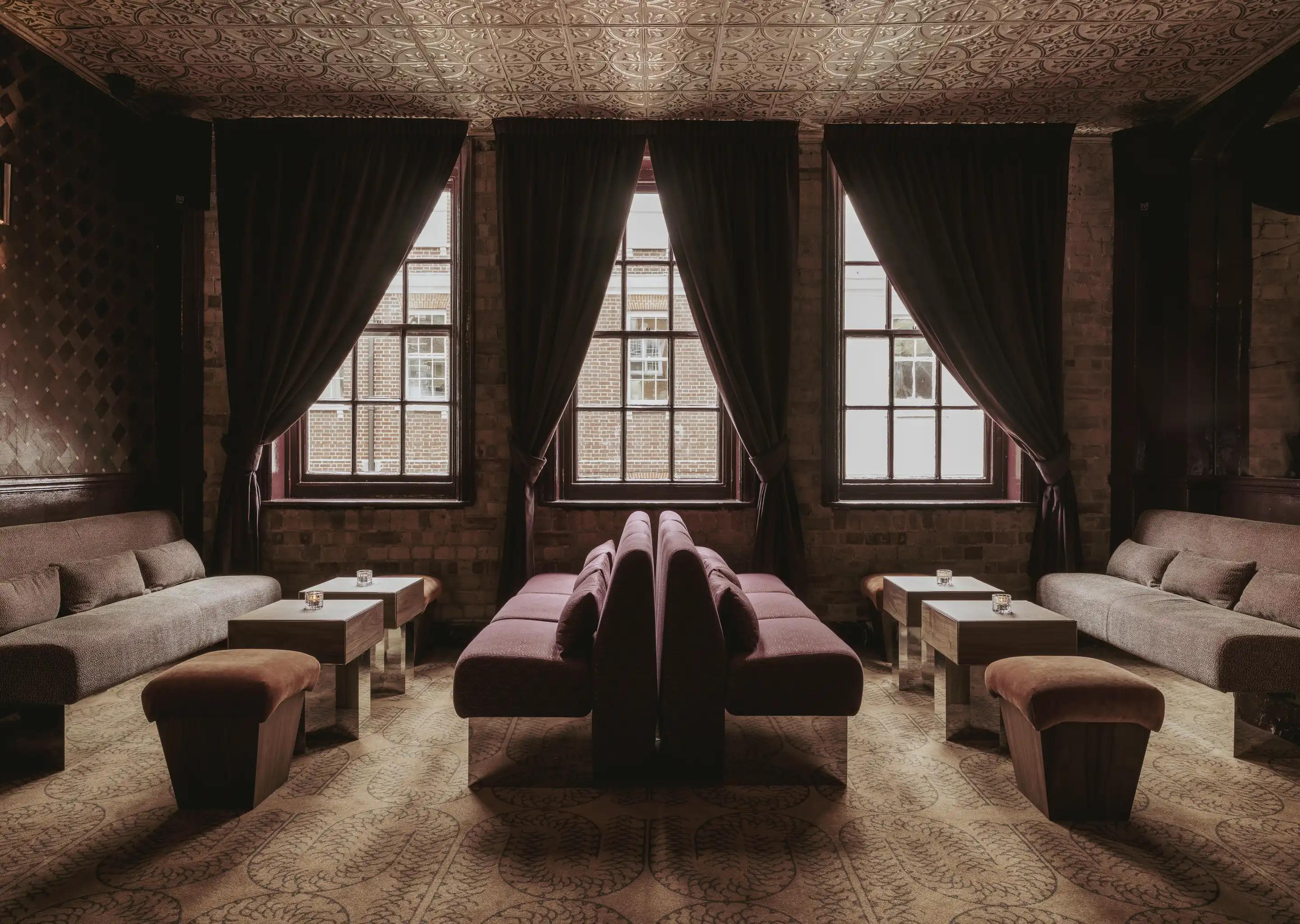 Lounge interior layout with symmetrical banquettes and windows, refined Experimental Group style.
