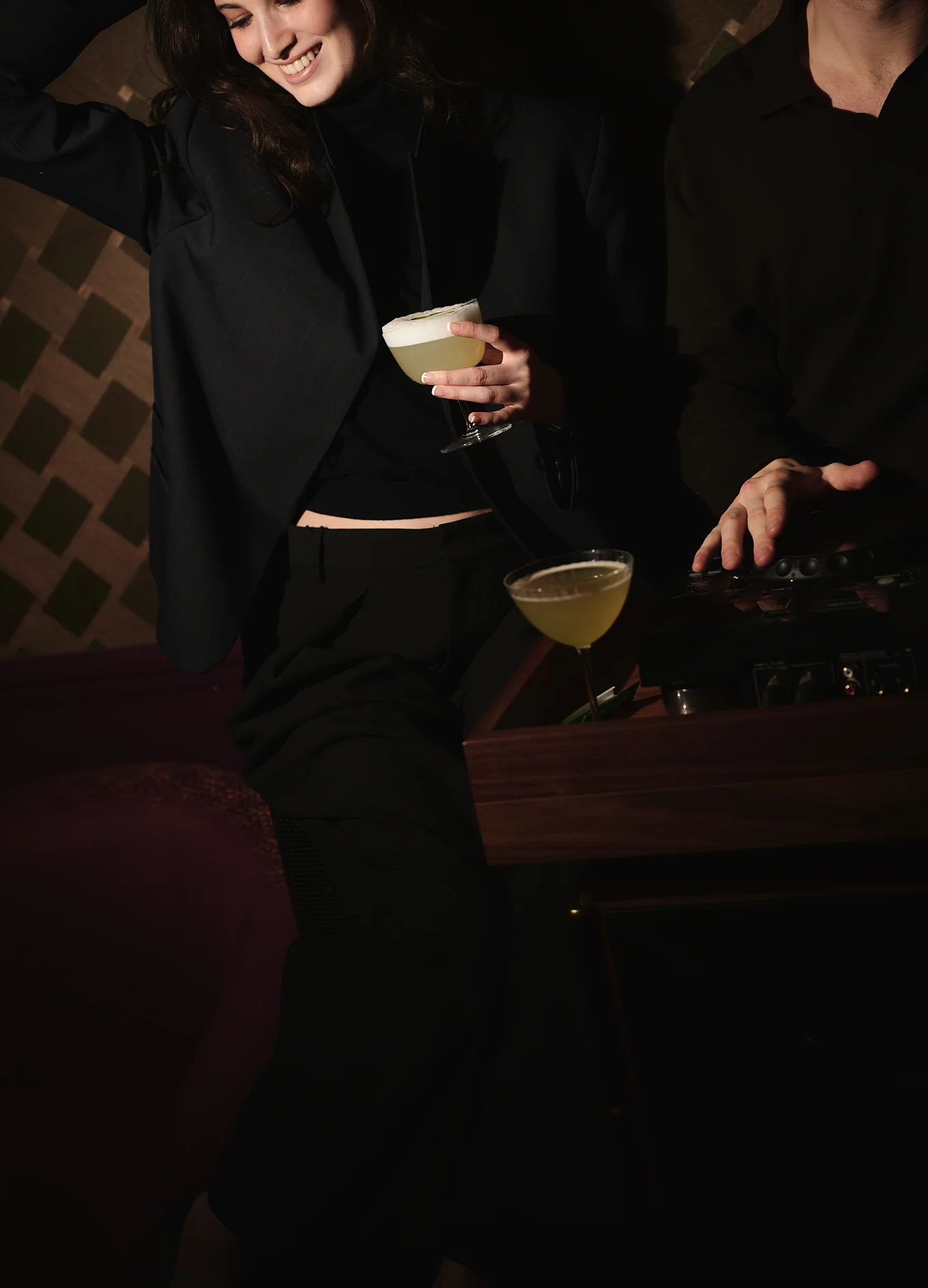 Festive and relaxed atmosphere in a cocktail bar, a woman holding a drink, Experimental Group.