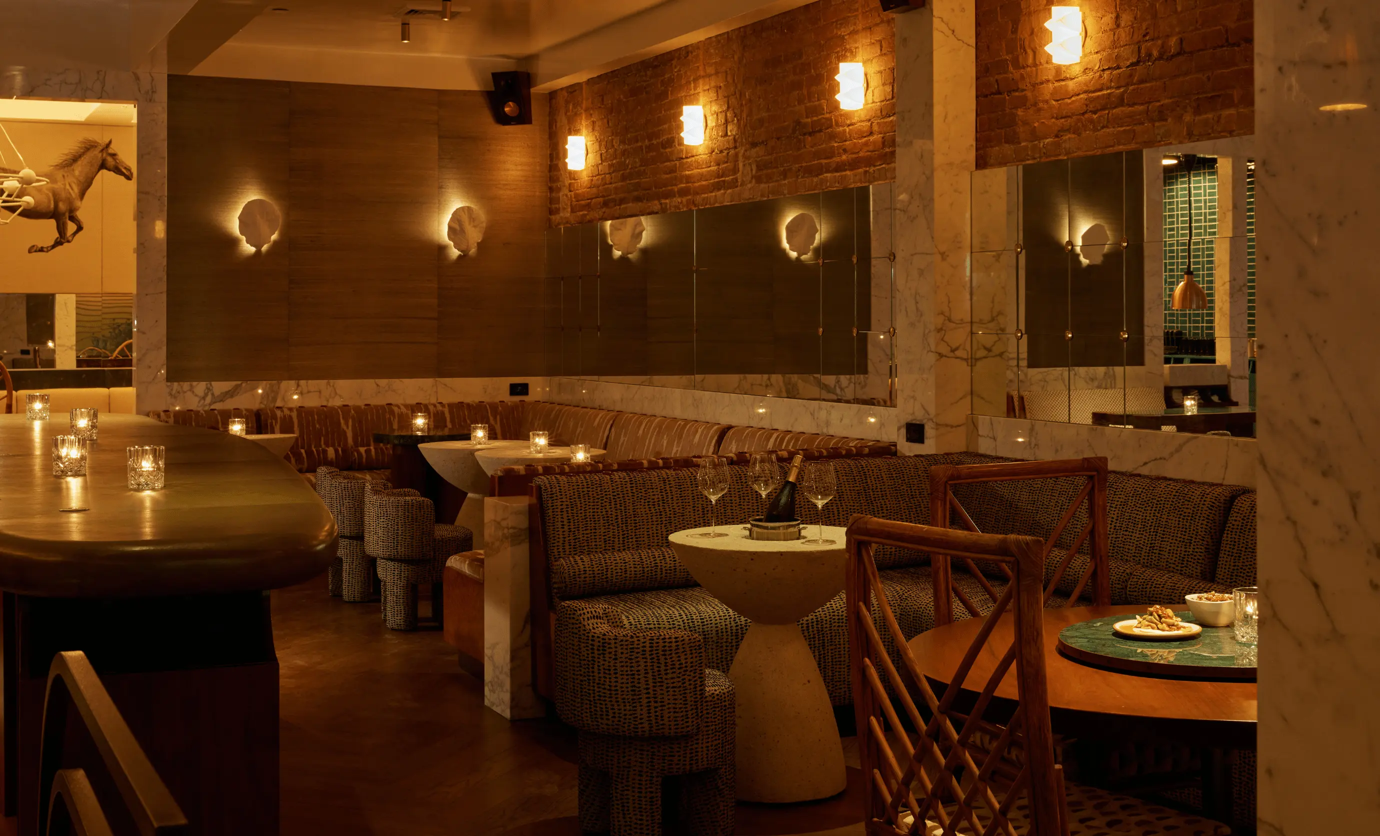 Stylish dining and bar area at La Compagnie des Vins Surnaturels, London, highlighting the signature intimate design of the Experimental Group.