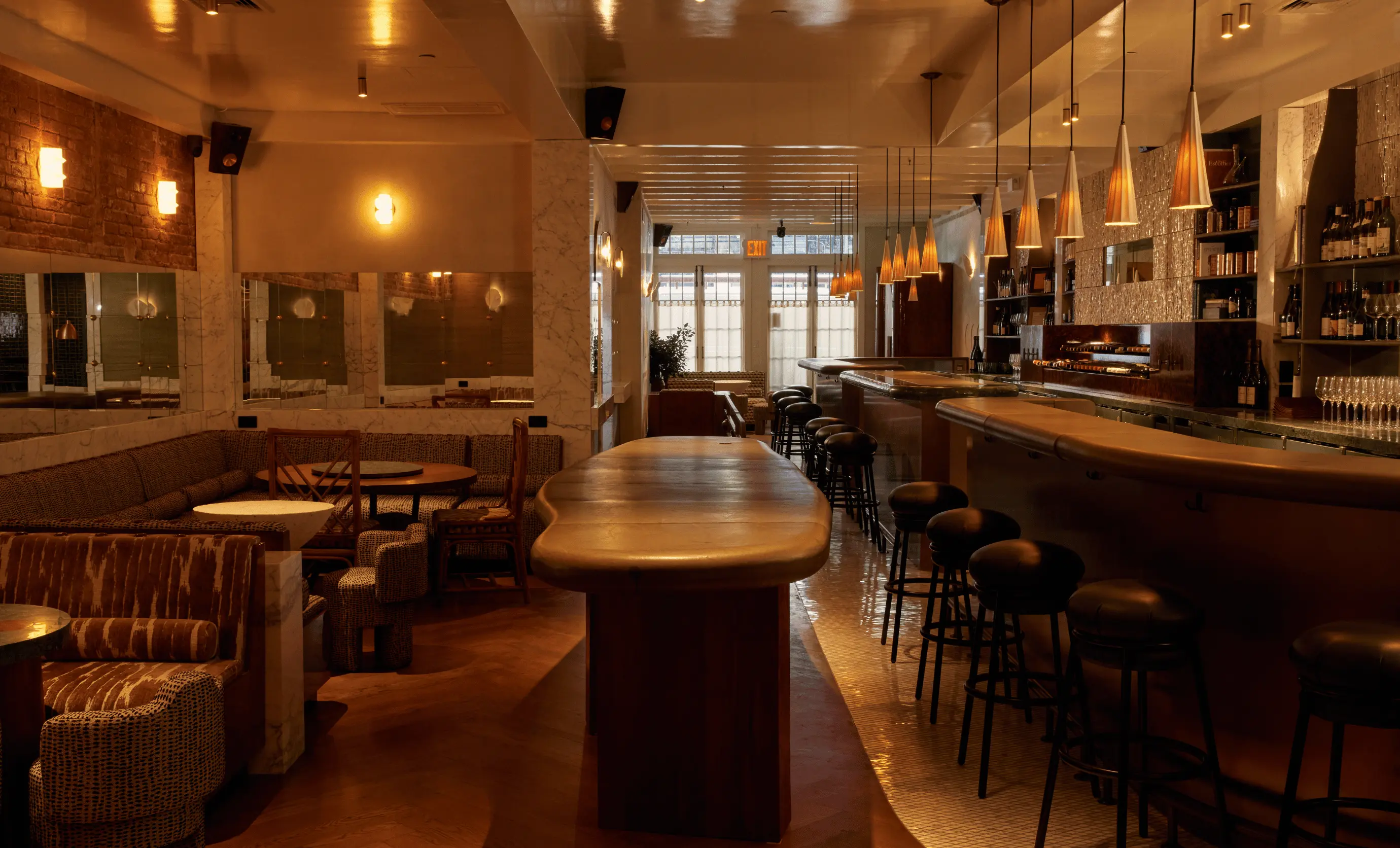 Sophisticated interior design of La Compagnie des Vins Surnaturels in London, showcasing the warm, immersive atmosphere created by the Experimental Group.