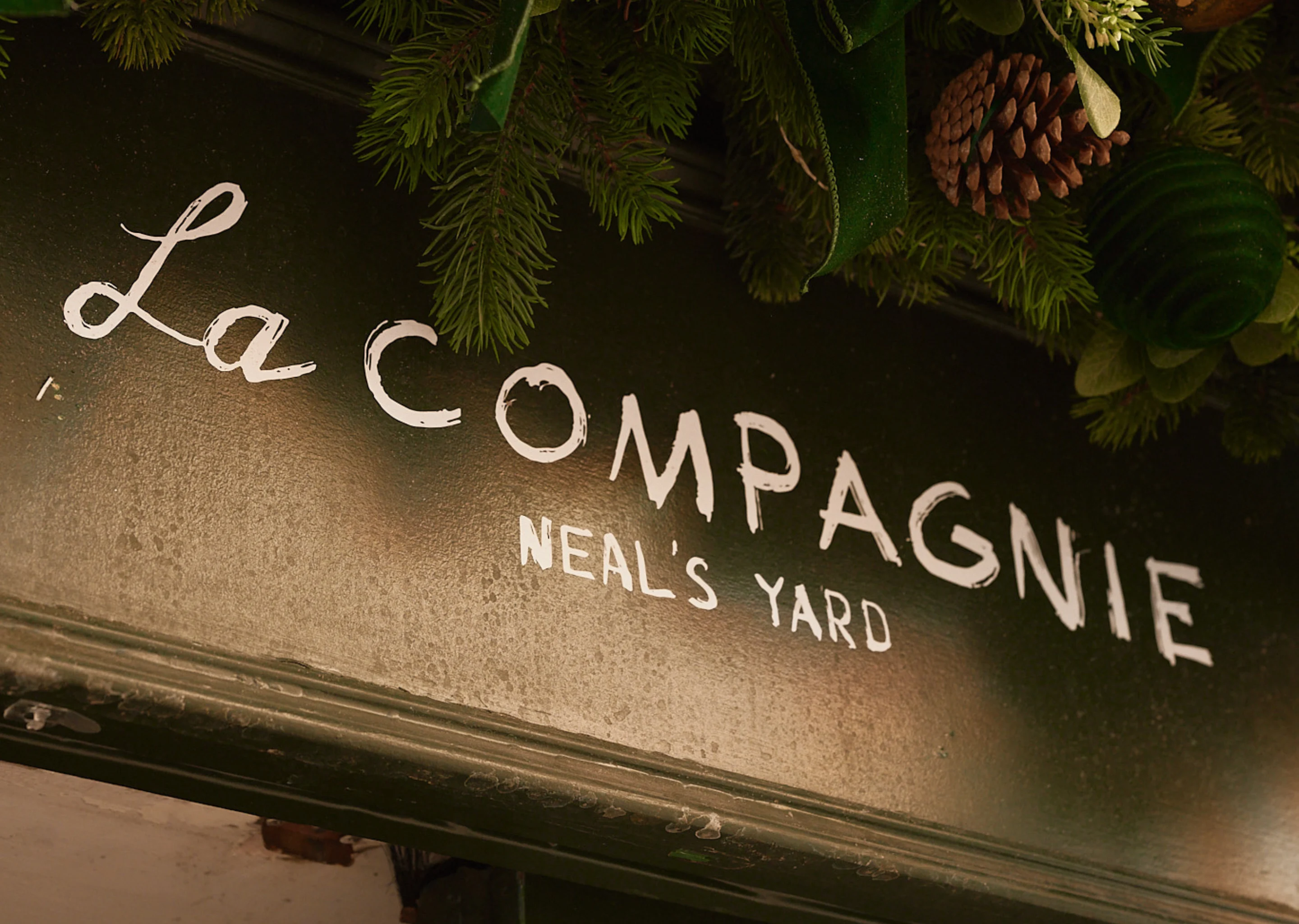 Exterior signage decorated for the holidays, La Compagnie, Neal's Yard, Experimental Group.