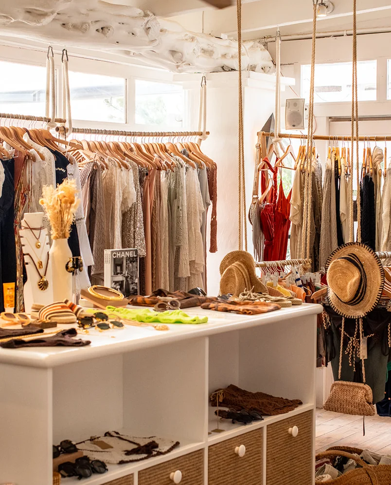 Interior of the Experimental Group lifestyle boutique showcasing a collection of bohemian clothing and accessories.