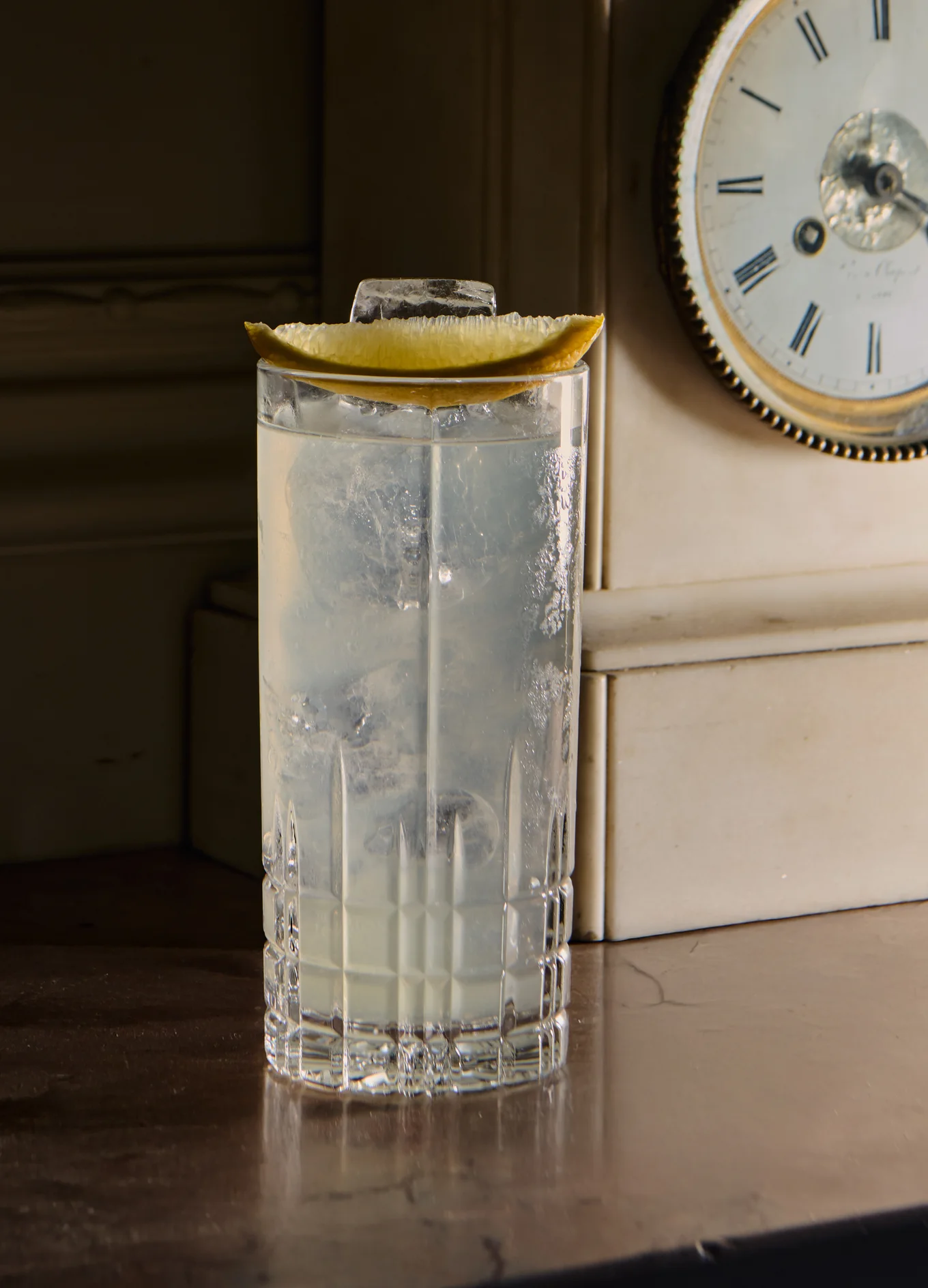 Refreshing signature cocktail garnished with citrus in a highball glass at the Experimental Chalet in Verbier.