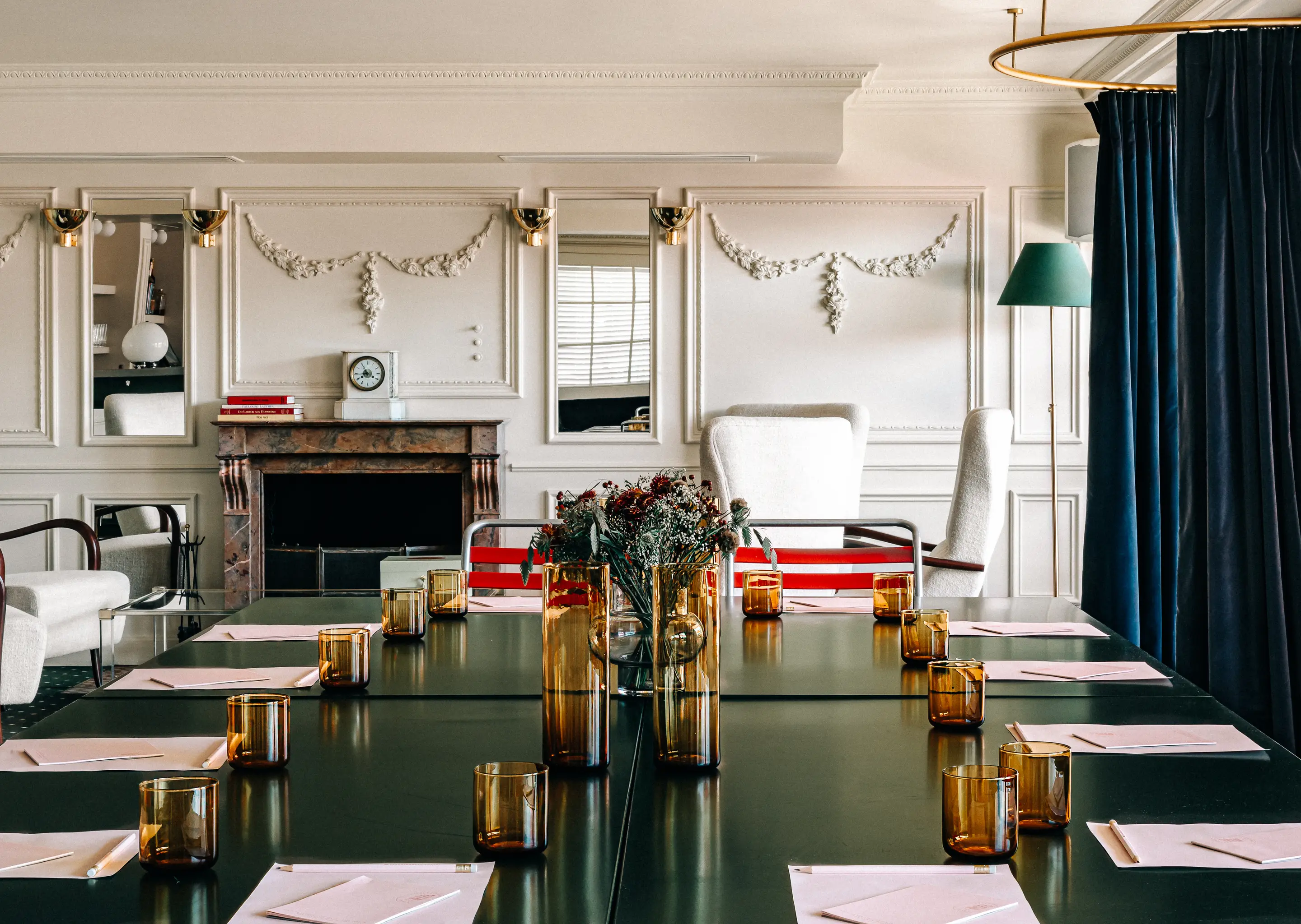 Wide view of the luxurious meeting space and fireplace lounge at the Experimental Cocktail Club in Verbier, featuring refined interior design.