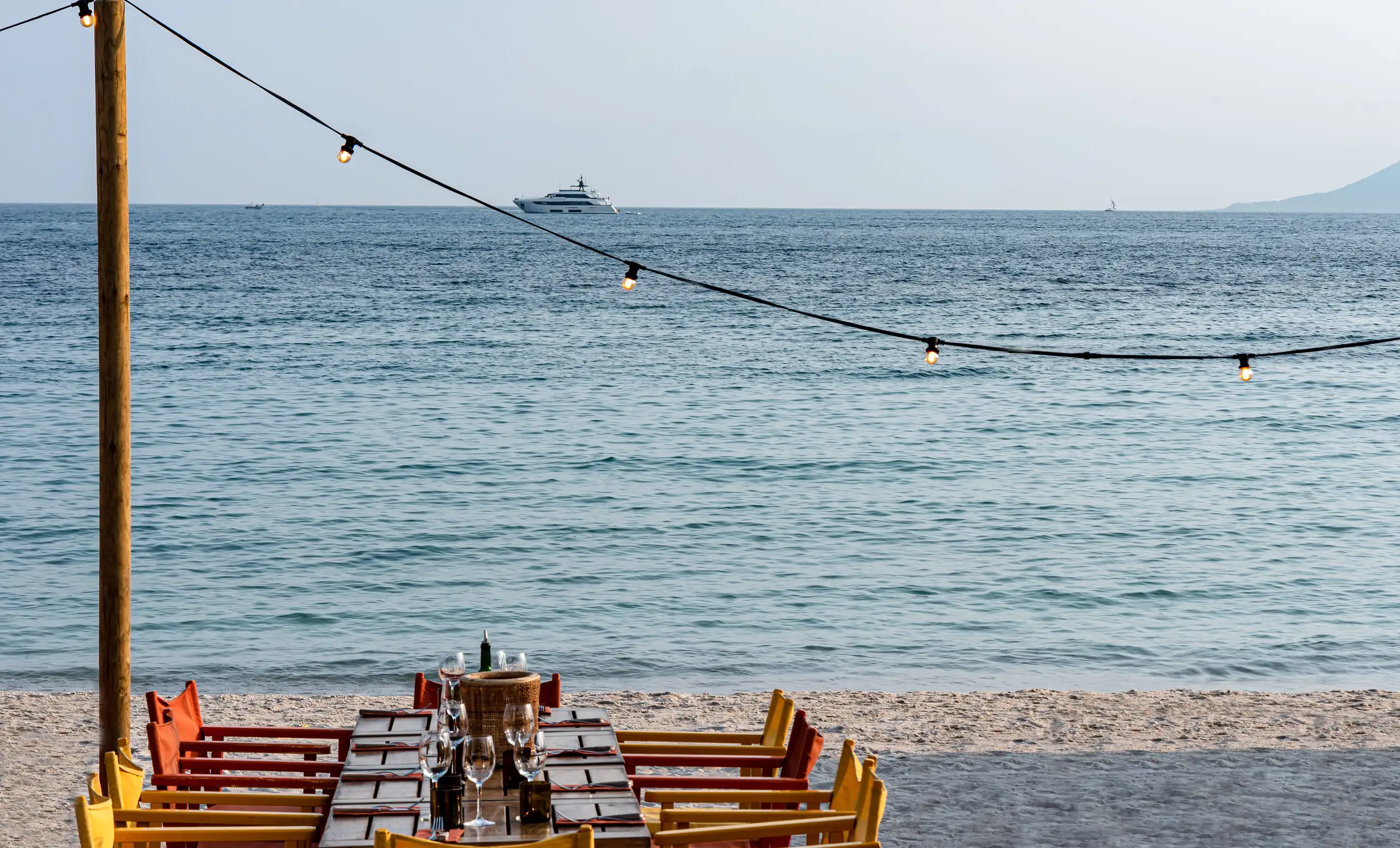 Outdoor restaurant ambiance on the sand, Experimental Group, seaside.