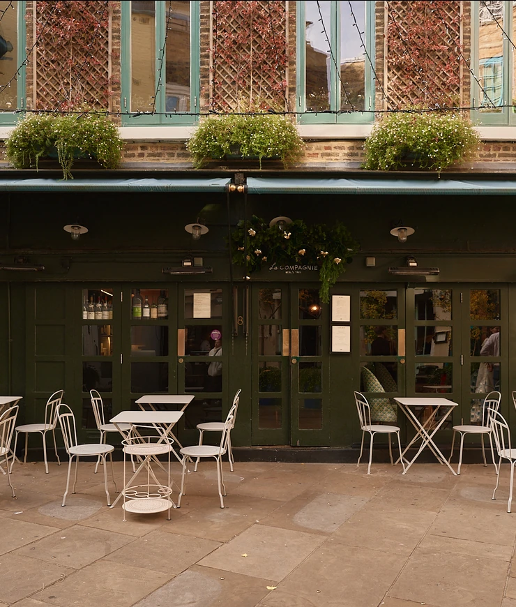 Exterior facade and terrace of La Compagnie bar, an Experimental Group establishment in London.