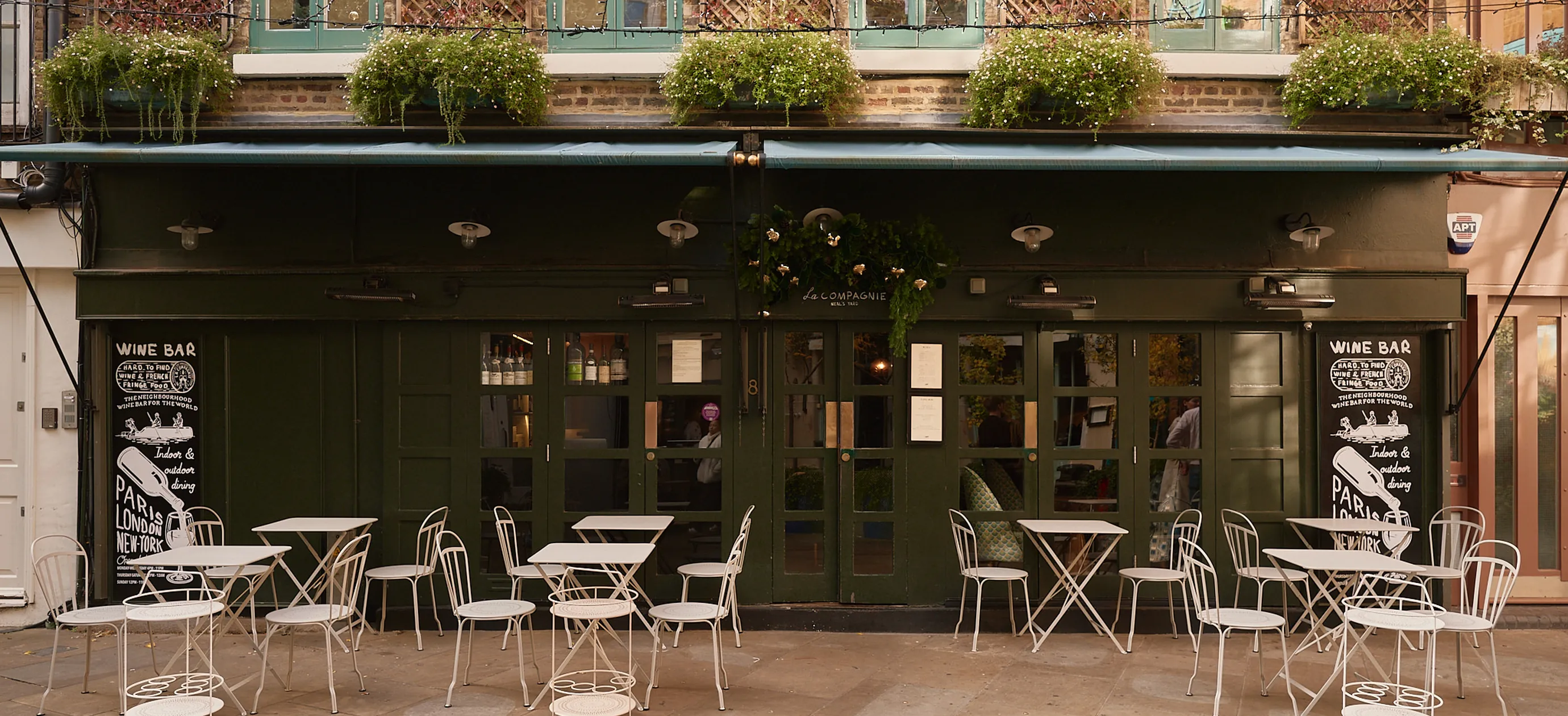 Exterior facade and terrace of La Compagnie bar, an Experimental Group establishment in London.