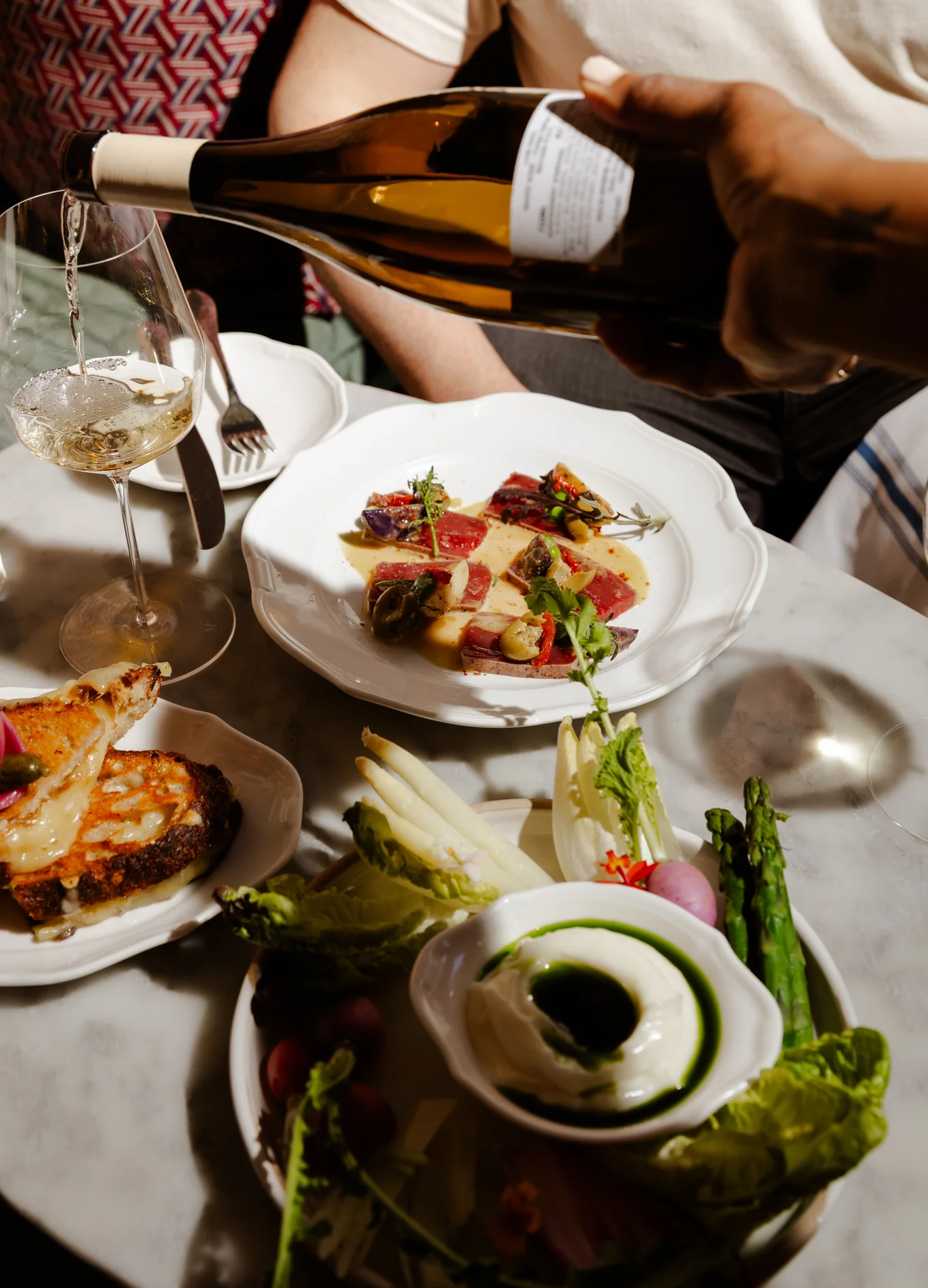 Culinary tasting and wine at an Experimental Group restaurant, an immersive gastronomy and mixology experience.