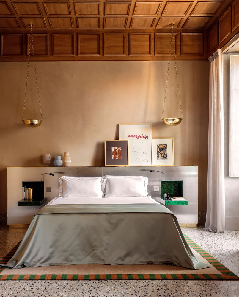 Interior of a refined bedroom featuring a contemporary headboard at Palazzo Experimental, Venice.