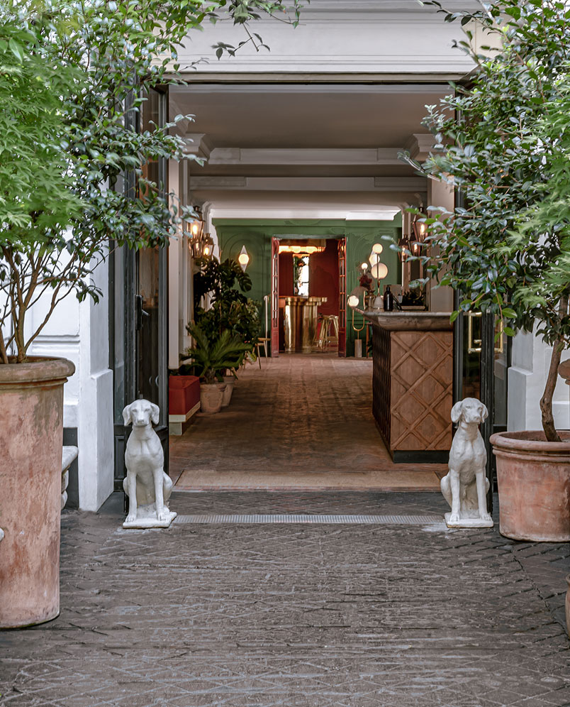Elegant pathway leading to the interior entrance of Palazzo Experimental, Venice.