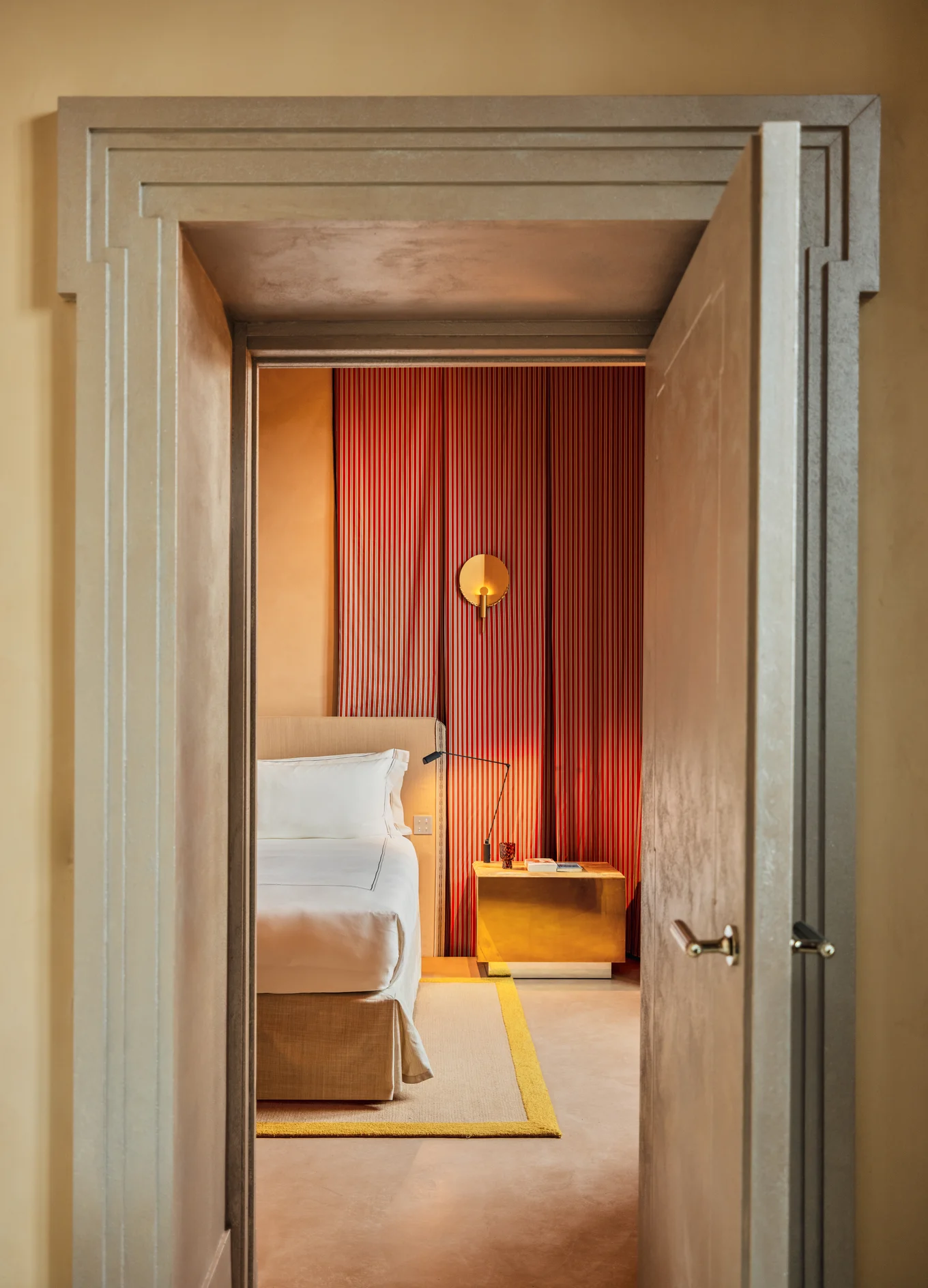 View from a doorway looking into an elegant room with contemporary Venetian style, Palazzo Experimental, Venice.