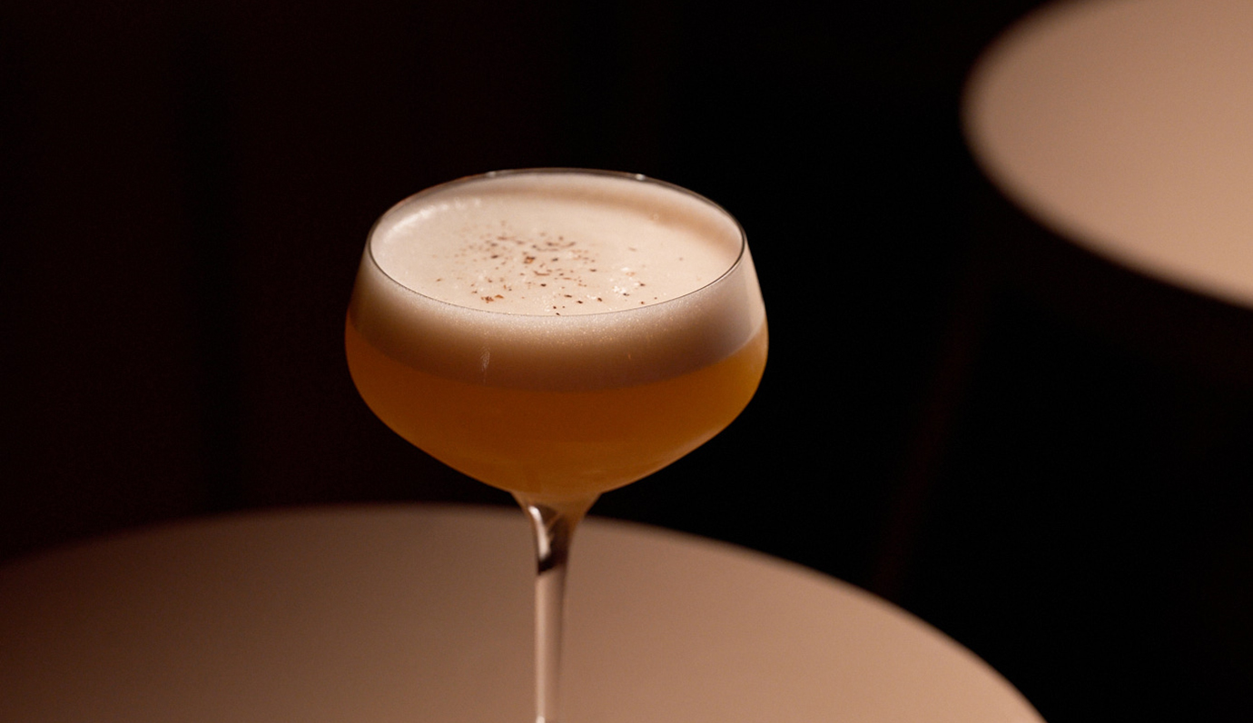 Signature cocktail served in an elegant stemmed glass at Palazzo Experimental, Venice.