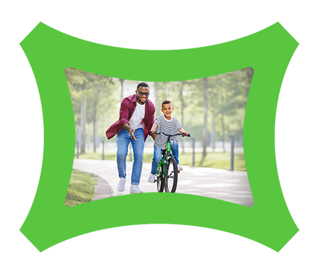 Father teaching his son to ride a bike