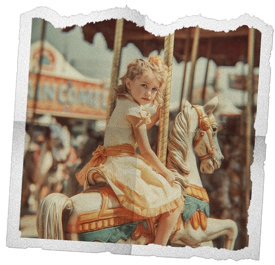 Young girl with curly hair in a vintage dress sitting on a decorated carousel horse.