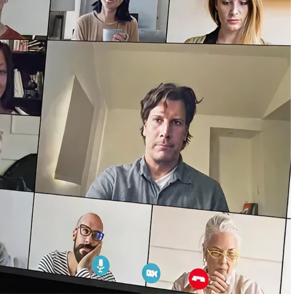 Grid view of six diverse people participating in a video conference call.