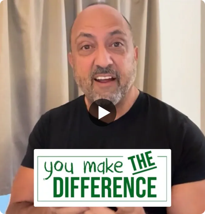 Man speaking while holding a text overlay reading 'You make THE DIFFERENCE'.