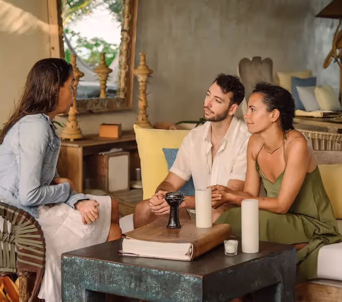 Guests relaxing and socializing in the cozy, bohemian-style lounge at La Valise Tulum Hotel.