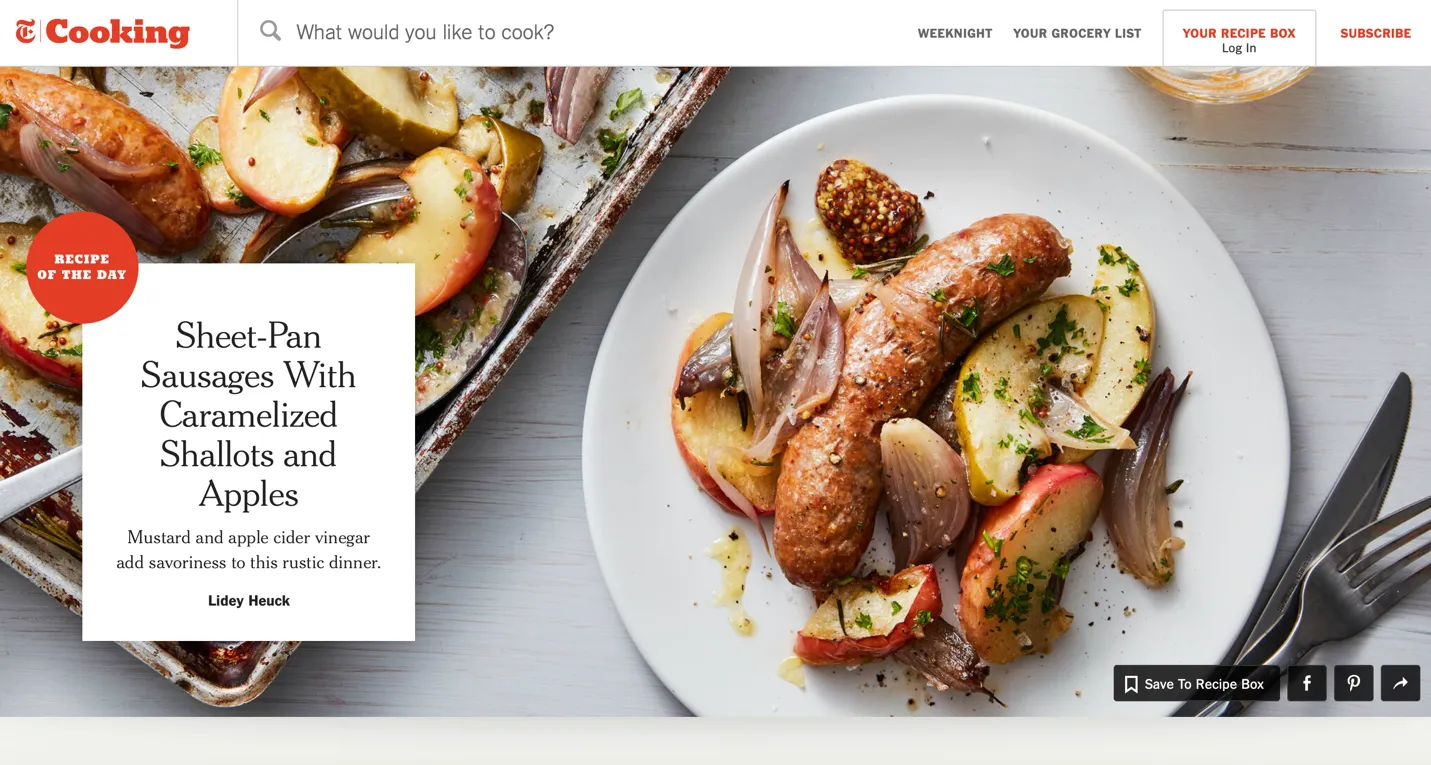 Image of NYT Cooking home page depicting Recipe of the Day on a white plate, which is holding cooked sausages, shallots, and apples