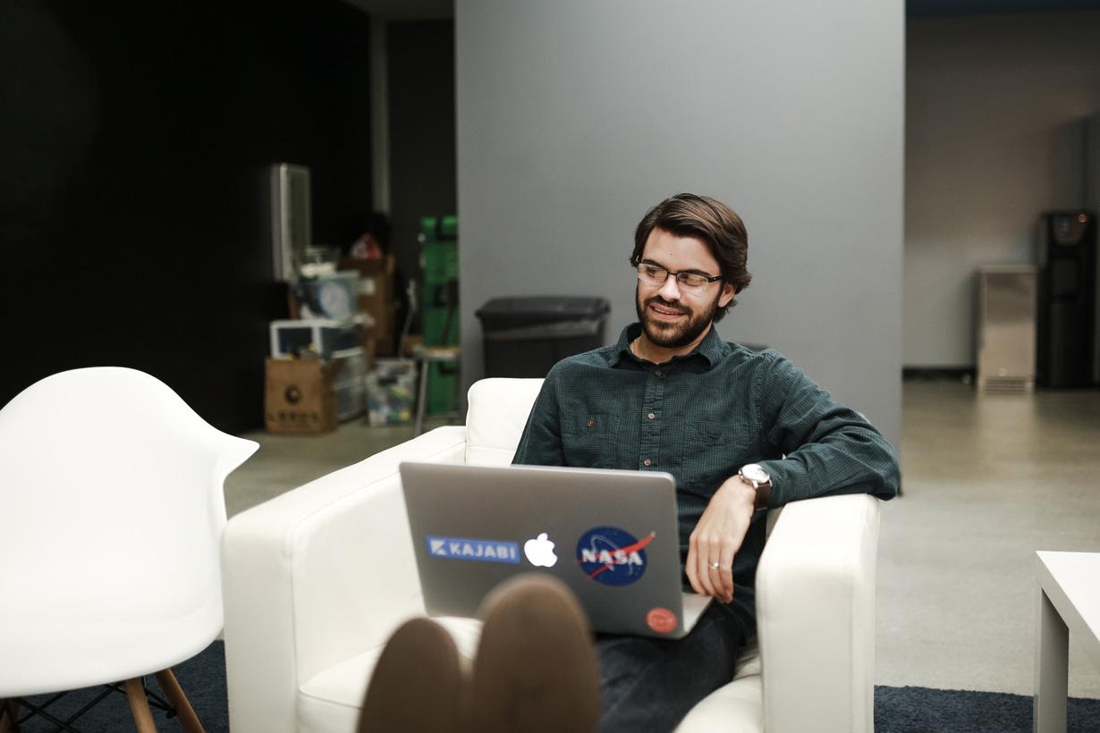 A person sitting on a tableDescription automatically generated