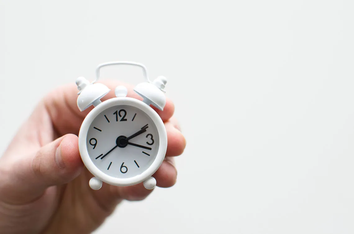 time ticking by on an alarm clock
