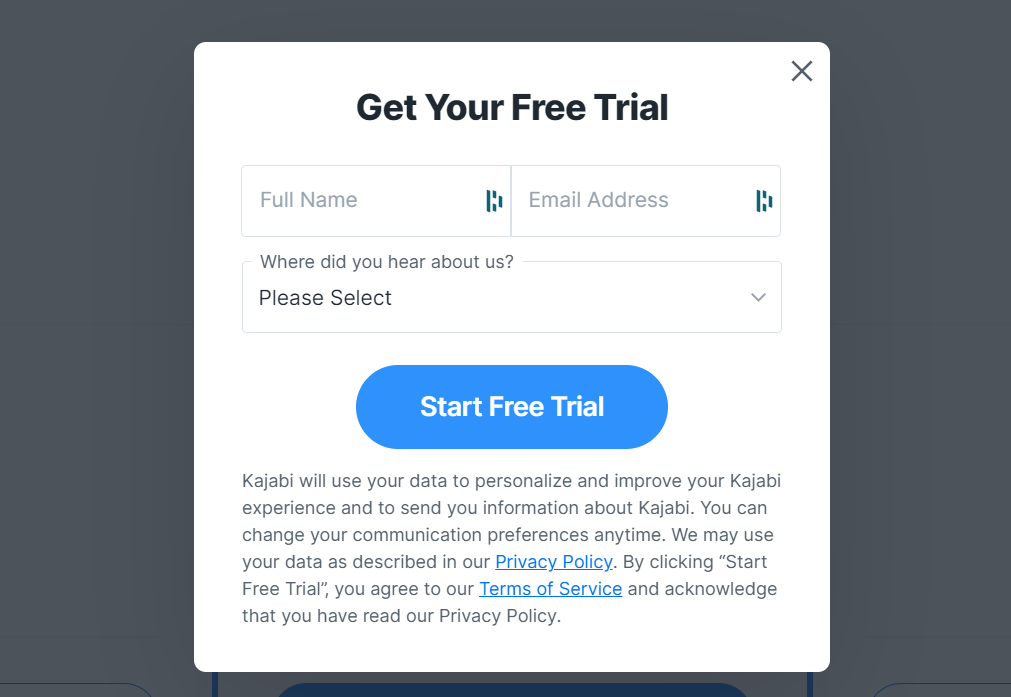 Screenshot of the Kajabi free trial form; simple dark grey and white design asking for name, email, and where the visitor heard about Kajabi