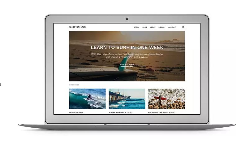 Laptop displaying online course about surfing